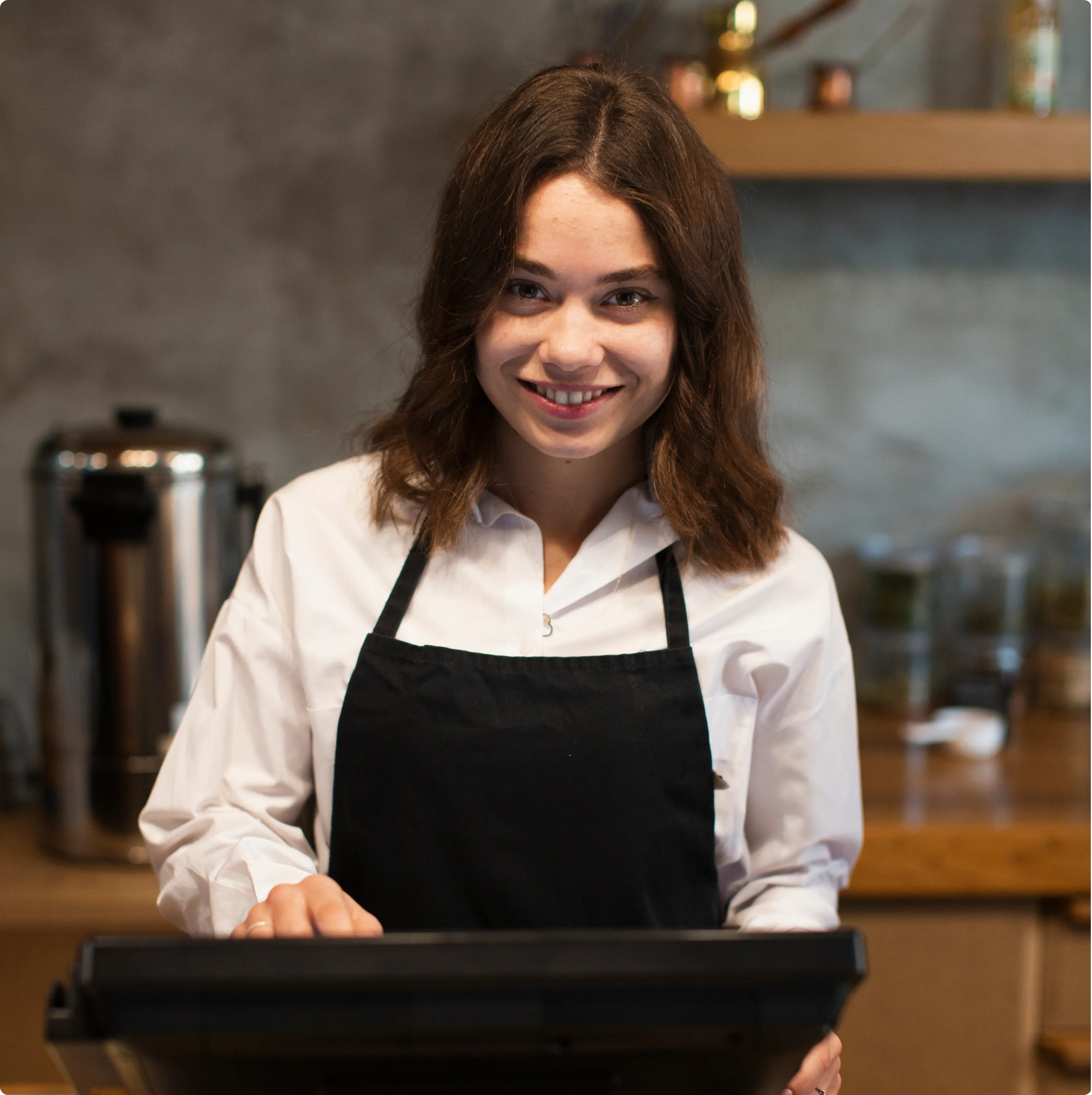 Cashier using POS system with a smile